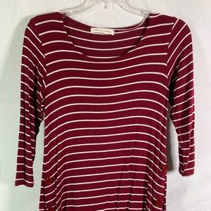 Striped shirt with buttons going up the sides